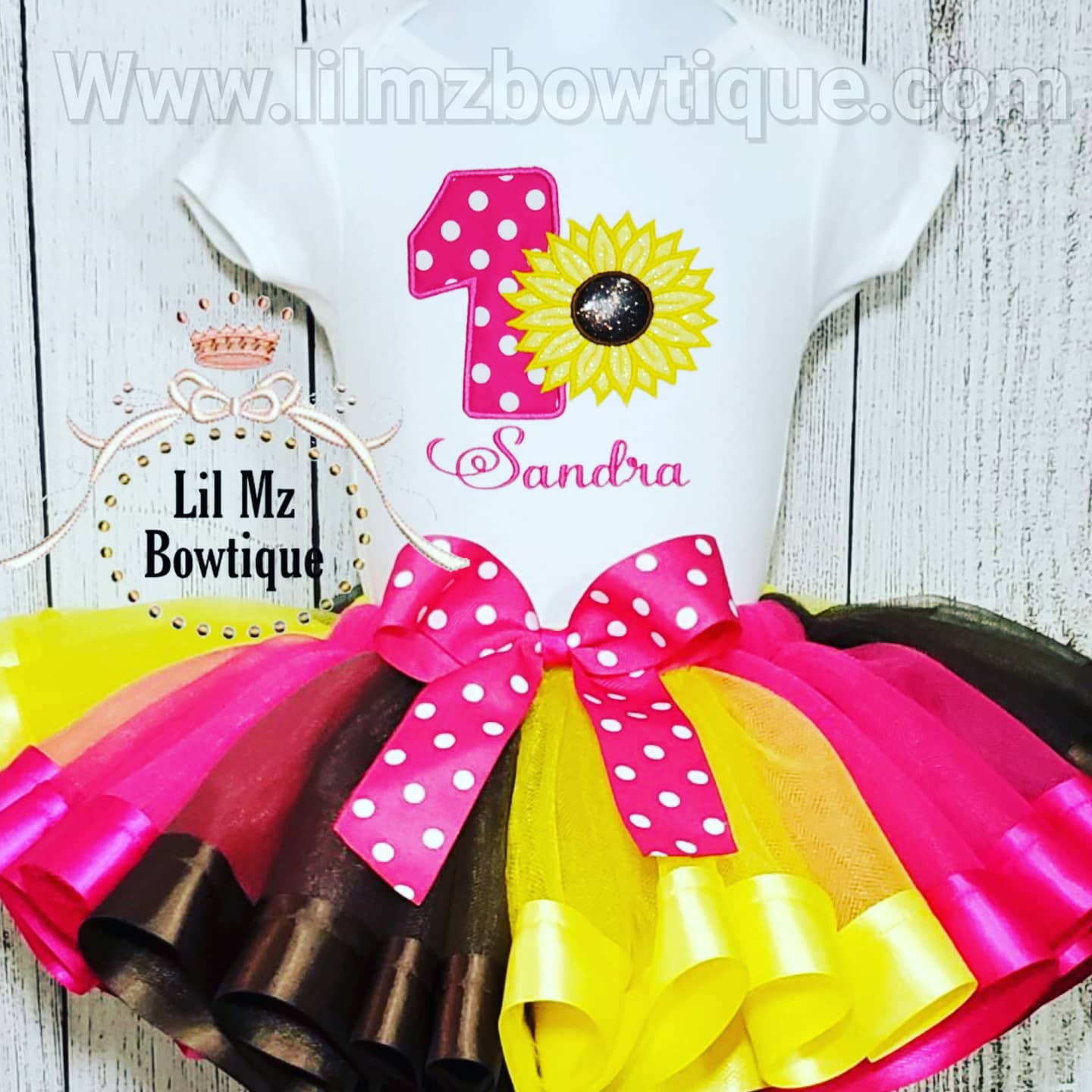Sunflower theme birthday tutu outfit with pink, yellow, and brown tulle skirt and embroidered number one shirt