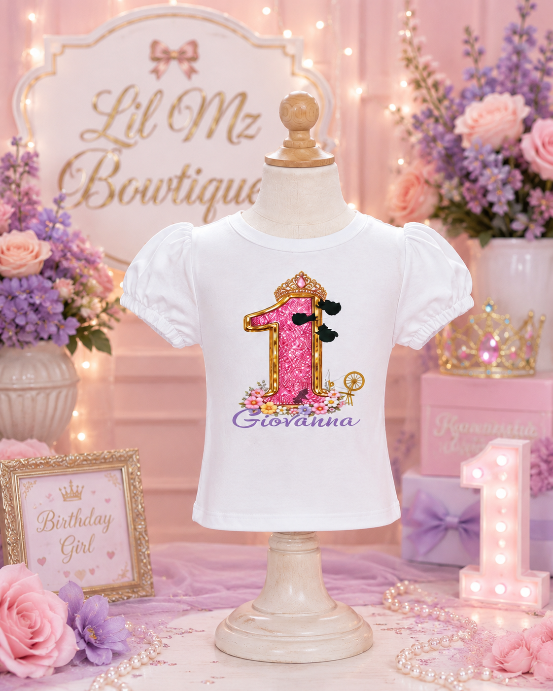 White t-shirt with pink number '1' and name on a mannequin against a decorative background.