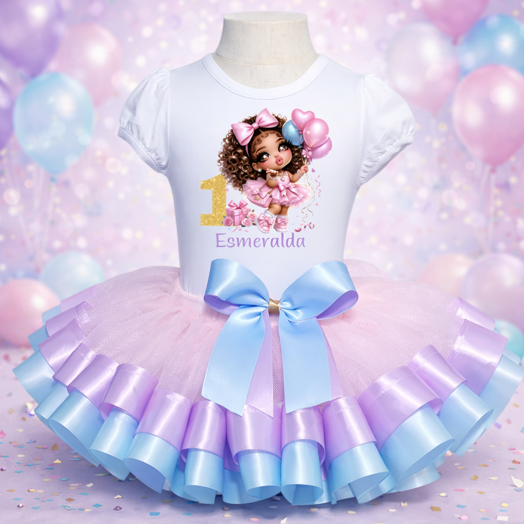 Children's outfit with a white top and pink and purple tutu skirt on a mannequin against a colorful balloon background.