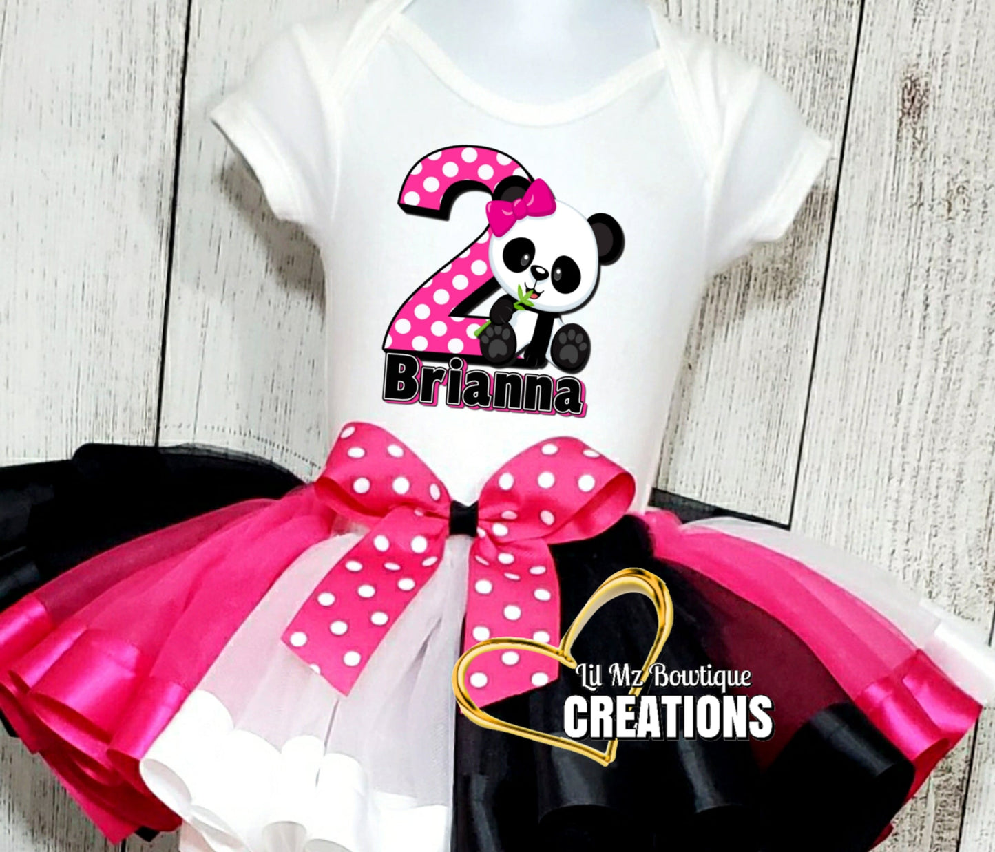 Personalized panda bear tutu outfit for toddlers with pink black and white tulle skirt and custom name and age on shirt