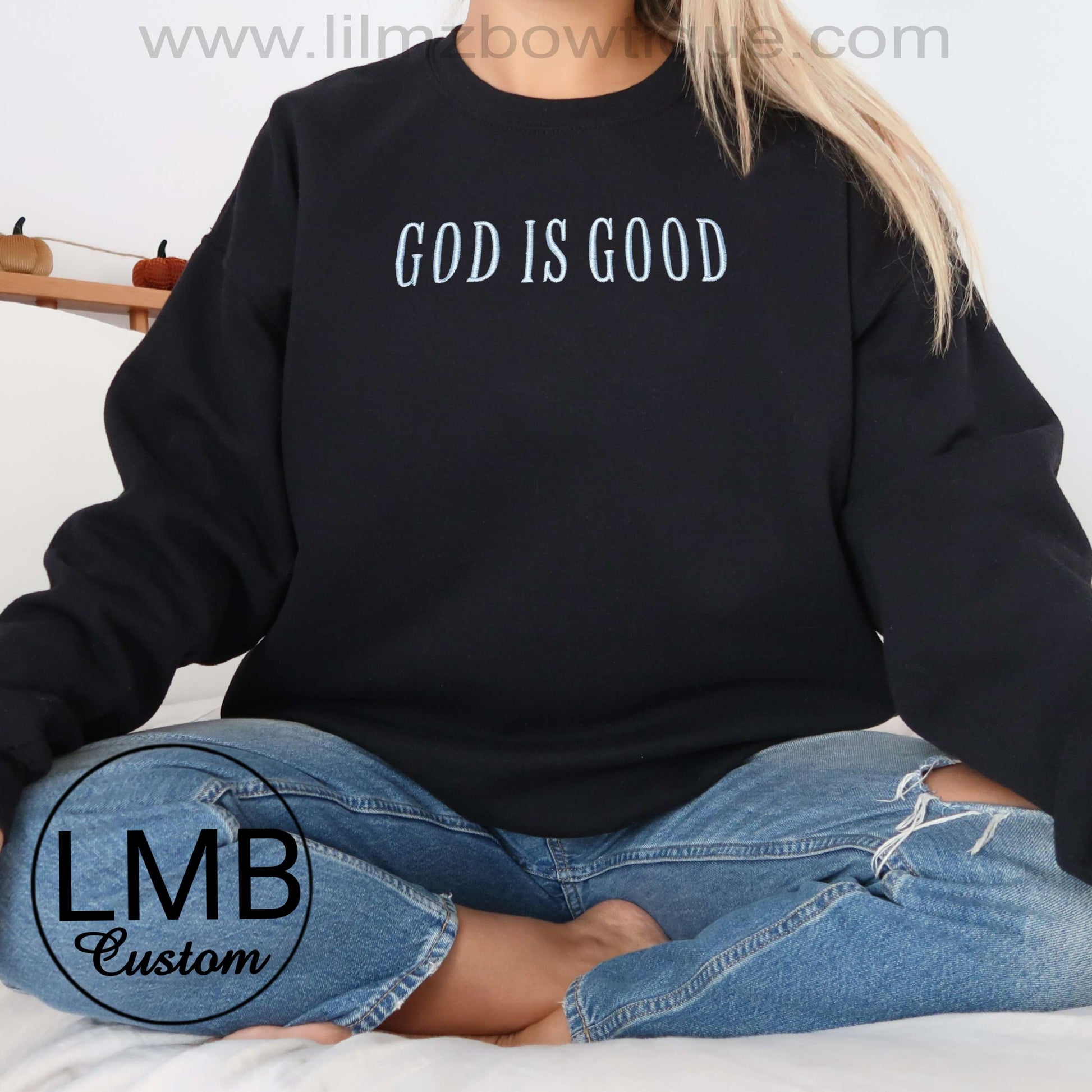 Black God Is Good adult sweatshirt with white text, made of soft lightweight cotton blend, casual unisex fit
