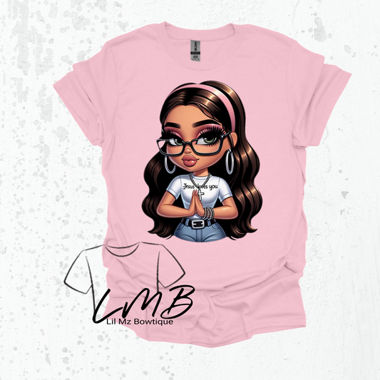 Pink Jesus loves us praying hands shirt with cartoon girl praying and wearing glasses and cross necklace